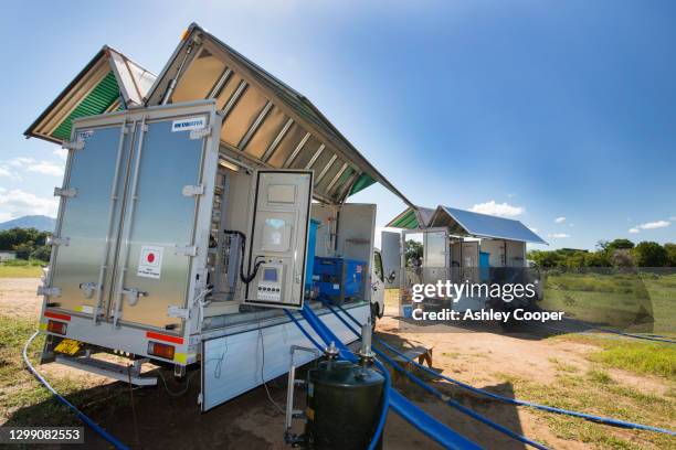 a specialist solar powered water purification truck that takes water straight from the river and purifies it to drinking standards. shire river, malawi. - displaced persons camp stock pictures, royalty-free photos & images