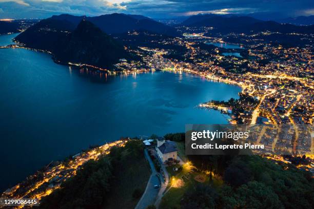 lugano from monte bré at night, switzerland - lugano - fotografias e filmes do acervo