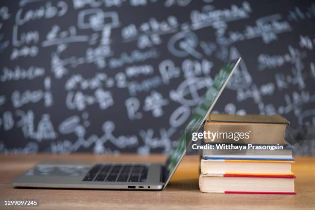 bookshelves and laptops are placed on the library desk.e-learning class and e-book digital technology - archival library stock pictures, royalty-free photos & images