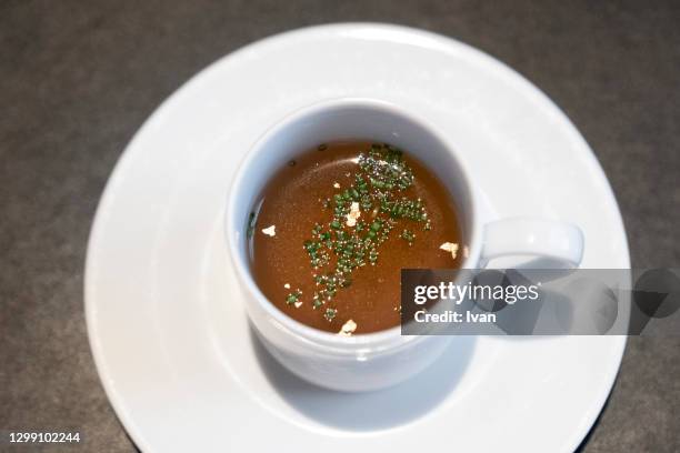 luxury french cuisine, chicken broth soup - hühnerbrühe stock-fotos und bilder
