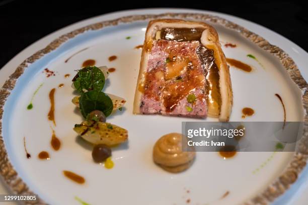 luxury french cuisine, sliced meat pie with foie gras on plate - pork pie stock pictures, royalty-free photos & images