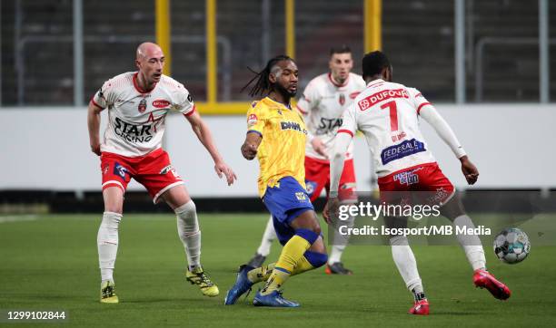 Ilombe Mboyo of STVV battles for the ball with Christophe Lepoint of Mouscron and Fabrice Olinga of Mouscron during the Jupiler Pro League match...