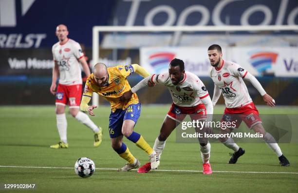 Steve De Ridder of STVV battles for the ball with Fabrice Olinga of Mouscron during the Jupiler Pro League match between STVV and Royal Excel...
