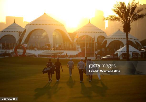 Richard Sterne of South Africa leads his group down the ninth fairway during the first round of the Omega Dubai Desert Classic at Emirates Golf Club...