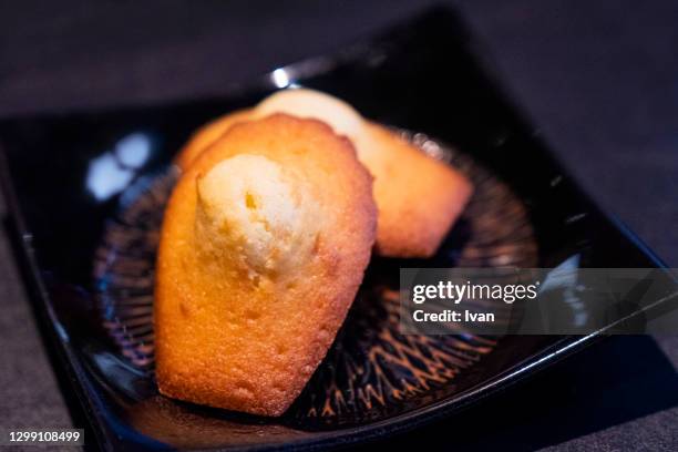 french dessert, fine dining, madeleine in restaurant - madeleine stock pictures, royalty-free photos & images