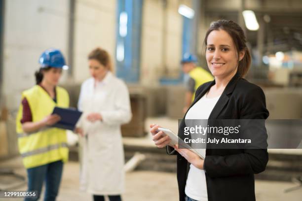 women working in factory with different roles. cordoba, spain. - foreman stock pictures, royalty-free photos & images