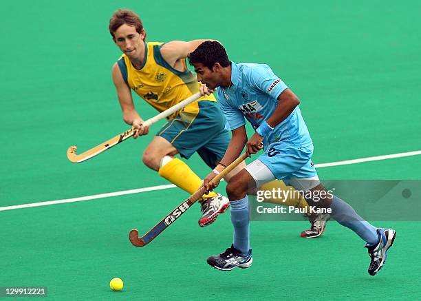 Yuvraj Walmiki of India looks to break clear from Jason Wilson of Australia during the match between Australia and India on day three of the...