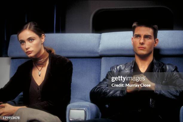 American actor Tom Cruise as Ethan Hunt and French actress Emmanuelle Beart as Claire Phelps in a scene from the film 'Mission: Impossible', 1996.