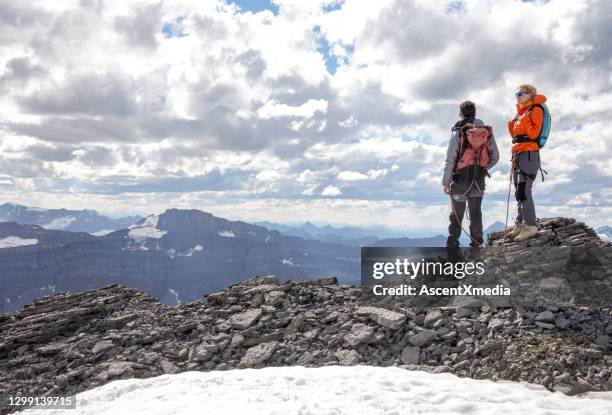 mountaineers relax on mountain ridge in the morning - 2 dramatic landscape stock pictures, royalty-free photos & images