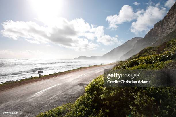 misty cliff beach road - cliff road stock pictures, royalty-free photos & images