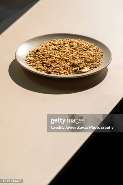 oat flakes on a plate - bran stock pictures, royalty-free photos & images