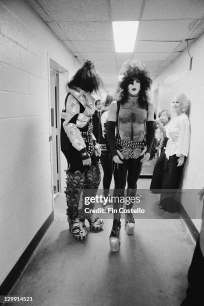 Guitarist Paul Stanley and bassist Gene Simmons of American heavy metal group Kiss, backstage, circa 1975.