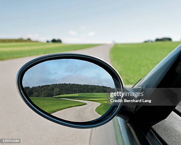 road reflected in side view mirror, close-up - vehicle mirror stock pictures, royalty-free photos & images