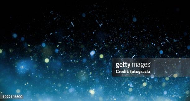 bokeh and dust background - snowfall and lights night defocussed stock pictures, royalty-free photos & images