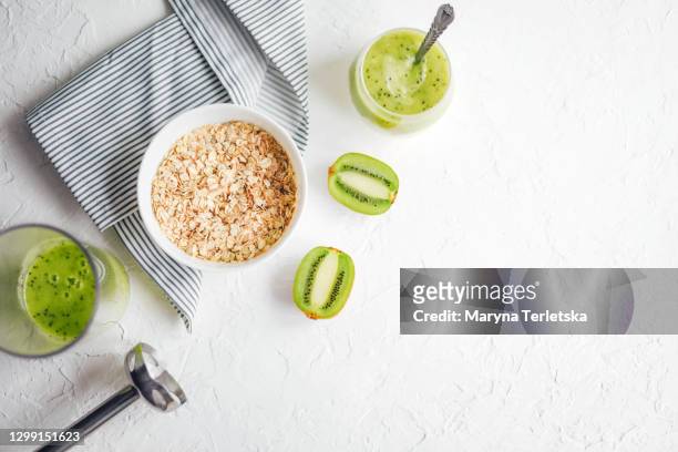 a plate with oatmeal, fruit and yogurt. - porridge stock pictures, royalty-free photos & images
