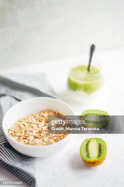 a plate with oatmeal, fruit and yogurt. - blender spill stock pictures, royalty-free photos & images