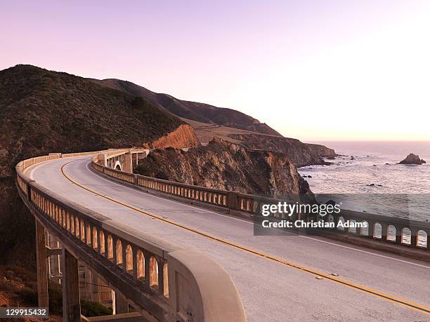 bridge at dusk - crash barrier stock pictures, royalty-free photos & images