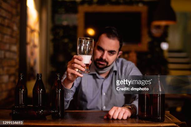 drunk man in bar - binge drinking stock pictures, royalty-free photos & images