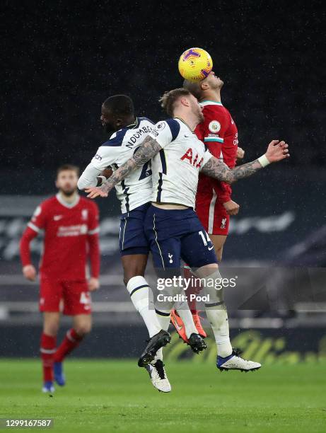 Joe Rodon of Tottenham Hotspur collides with Thiago Alcantara of Liverpool in the air which leads to a head injury during the Premier League match...