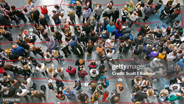 people wait in queues - line up stockfoto's en -beelden