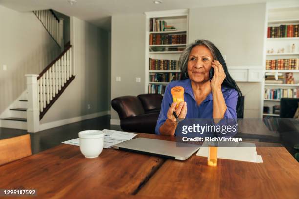 senior woman on telemedicine visit - prescription medicine stock pictures, royalty-free photos & images