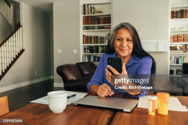 senior kvinna på telemedicin besök - indian economy business and finance bildbanksfoton och bilder
