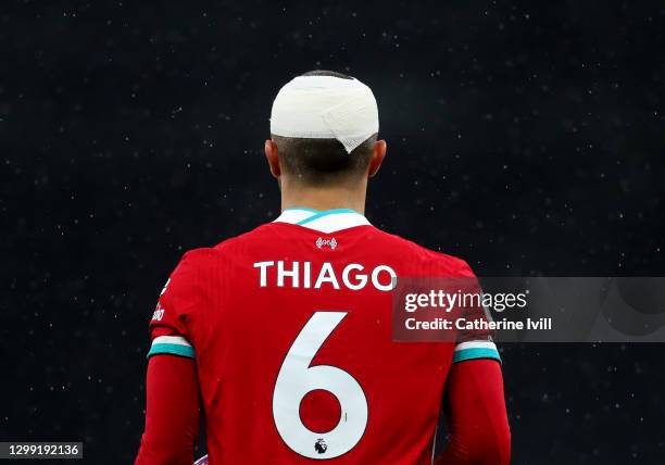 Thiago Alcantara of Liverpool with a bandage on his head after sustaining a head injury during the Premier League match between Tottenham Hotspur and...