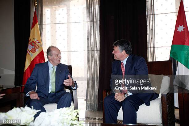 King Juan Carlos of Spain meets with Jordan's King Abdullah II during his participation at the World Economic Forum special meeting on economic...