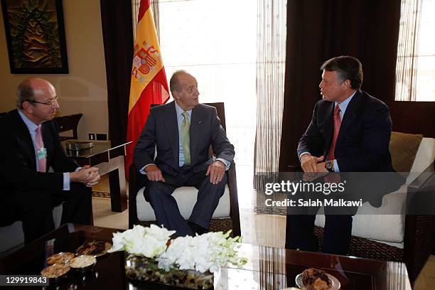 King Juan Carlos of Spain meets with Jordan's King Abdullah II during his participation at the World Economic Forum special meeting on economic...