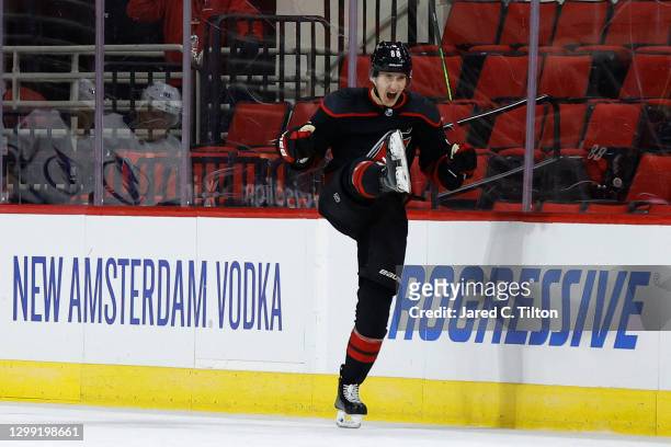 Martin Necas of the Carolina Hurricanes celebrates after scoring the game-winning goal in overtime of their game against the Tampa Bay Lightning at...