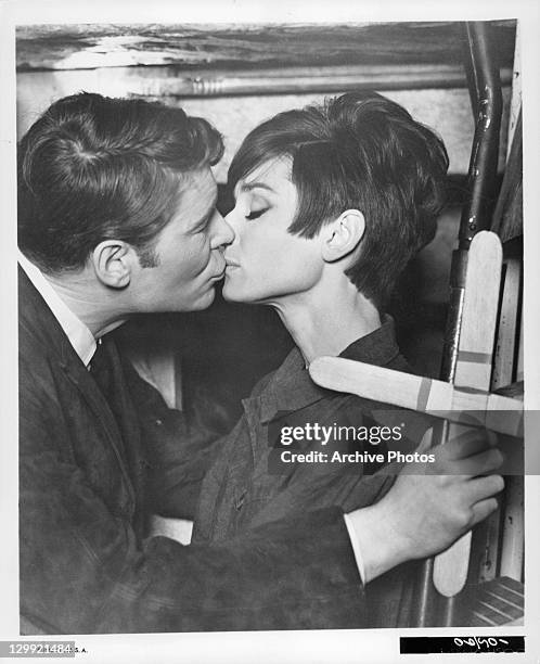 Peter O'Toole kissing Audrey Hepburn in a scene from the film 'How To Steal A Million', 1966.