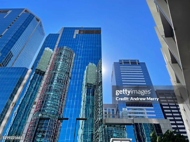 skyscraper, high rise glass corporate buildings and blue sky, sydney, australia - office building australia stock-fotos und bilder