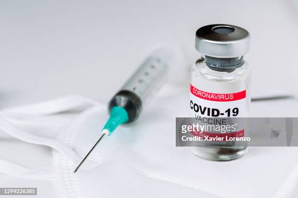 vial with coronavirus covid-19 vaccine - covid 19 vaccine stock pictures, royalty-free photos & images