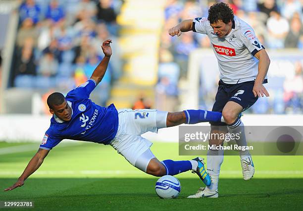 Lee Peltier of Leicester is fouled by Darius Henderson of Millwall during the npower Championship match between Leicester City and Millwall at the...