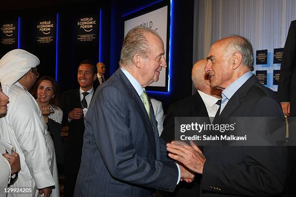 King Juan Carlos of Spain is greeted by Munib al-Masri during his participation at the World Economic Forum special meeting on economic growth and...