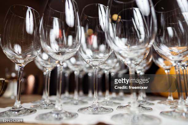 wine glasses on a bar counter in restaurant - empty glass stock pictures, royalty-free photos & images