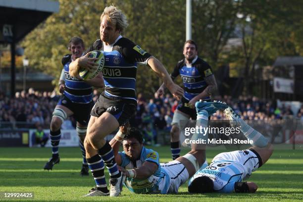 Nick Abendanon of Bath powers his way through the Worcester defence to score a try during the LV Cup match between Bath and Worcester Warriors at the...