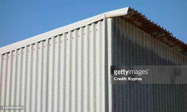 utility building or shed - greece - corrugated metal stockfoto's en -beelden