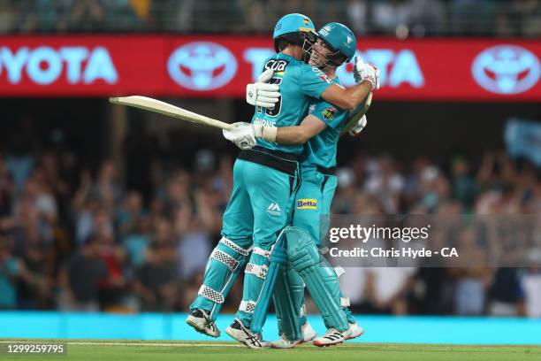 Jimmpy Peirson and Joe Burns of the Heat celebrate winning the Big Bash League Eliminator Final match between the Brisbane Heat and the Adelaide...