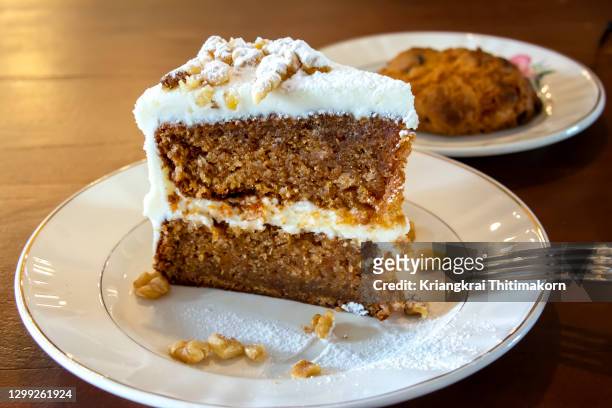 delicious carrot cake for snack with coffee. - carrots white background stockfoto's en -beelden