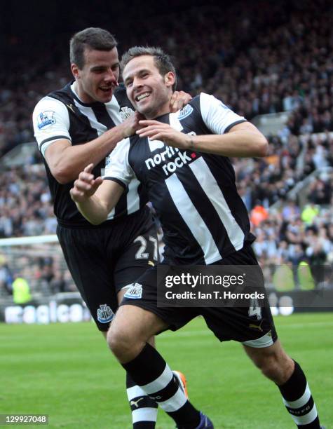 Yohan Cabaye of Newcastle United celebrates with team-mate Steven Taylor after scoring the 1-0 goal during the Barclays Premier League match between...