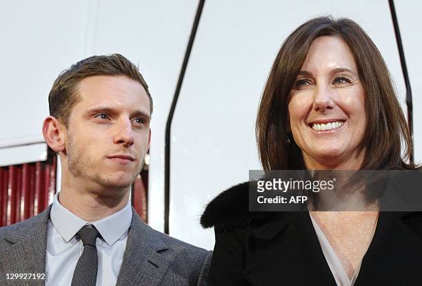 British Actor Jamie Bell and US Producer Kathleen Kennedy pose as they arrive in Paris, on October 22 in front of a special Thalys train in the...