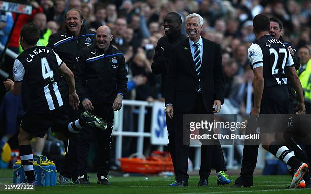 Newcastle United manager Alan Pardew shows his delight as he watches goal scorer Yohan Cabaye run to the bench to celebrate during the Barclays...