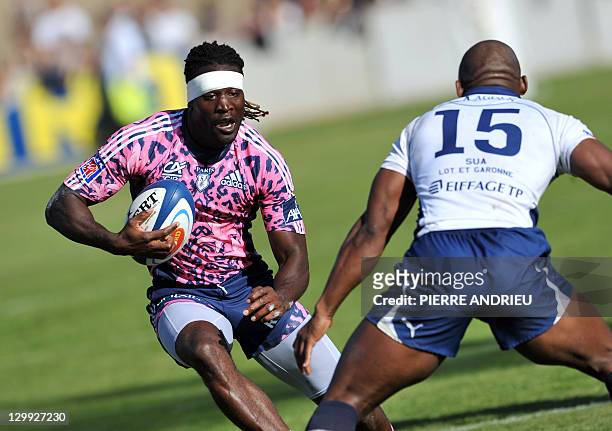 Stade Francais' right-wing Paul Sackey collapses with Agen's fullback Silvère Tian during the French Top 14 rugby union match Agen vs Stade Français...