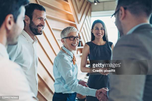 sealing the deal with a handshake - finance and economy stock pictures, royalty-free photos & images