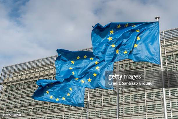 european union flags at berlaymont building of the european commission - unión europea fotografías e imágenes de stock