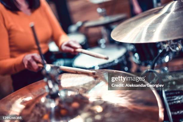 female drummer hitting the cymbals - heavy metal drummer stock pictures, royalty-free photos & images