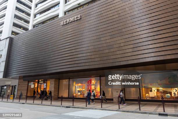 hermès flagship store in hong kong - hermes store stock pictures, royalty-free photos & images