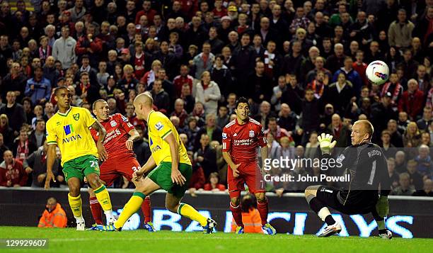 Craig Bellamy of Liverpool scores the opening goal during the Barclays Premier League match between Liverpool and Norwich City at Anfield on October...