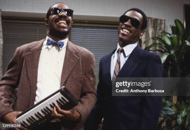 American musician Stevie Wonder appears on an episode of 'Saturday Night Live' with comedian and actor Eddie Murphy , New York, New York, 1983.